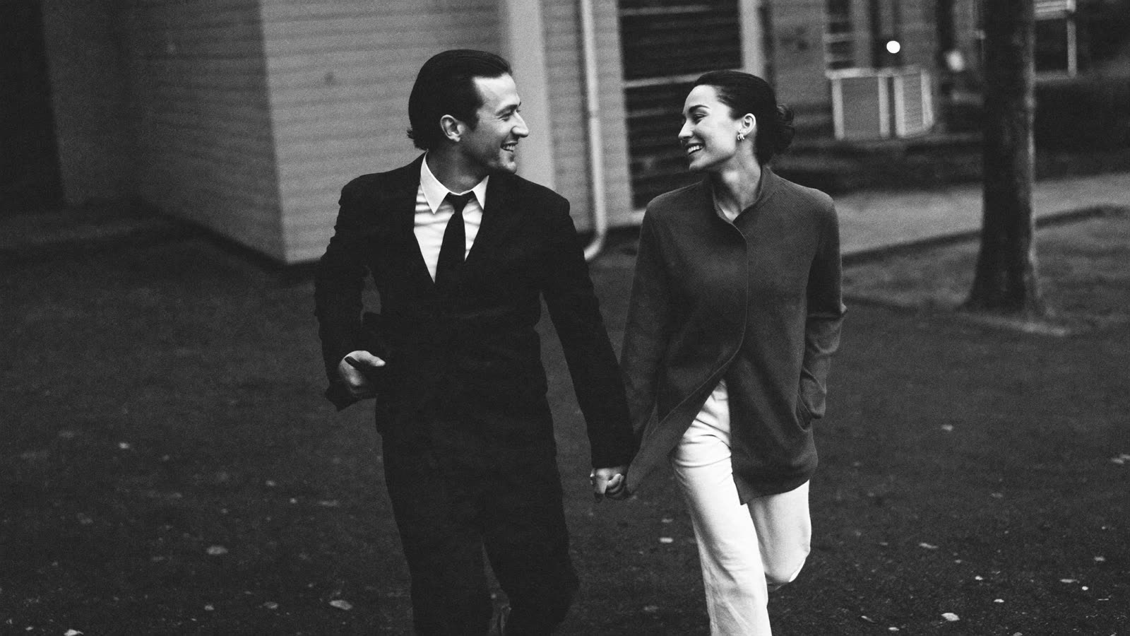 A couple walking together, holding hands